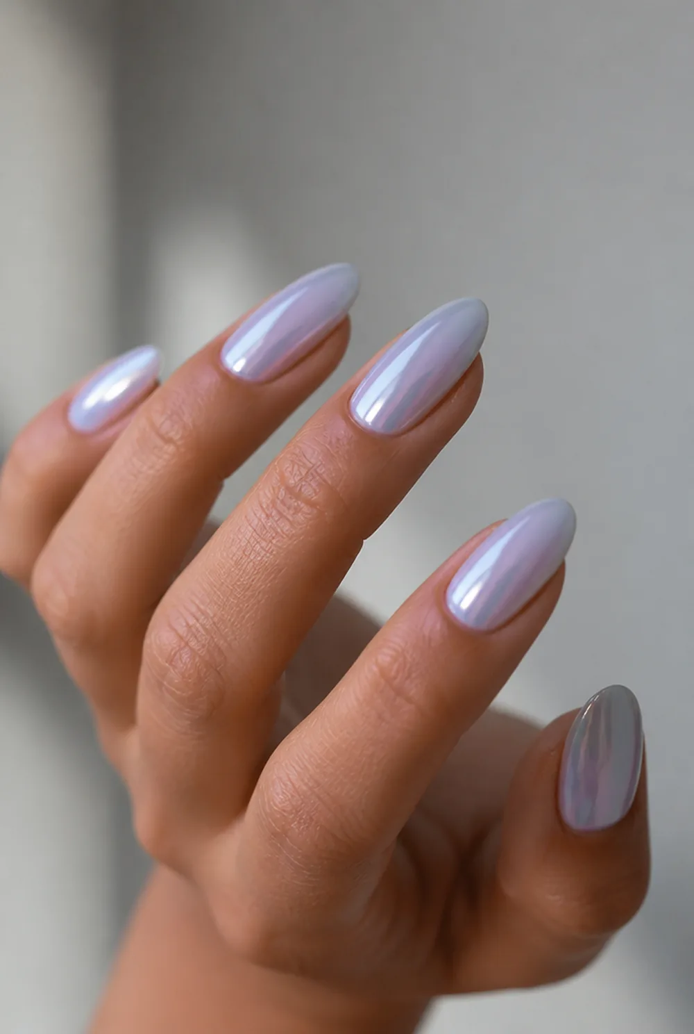 blue glazed pearl nail art on olive skin, long length