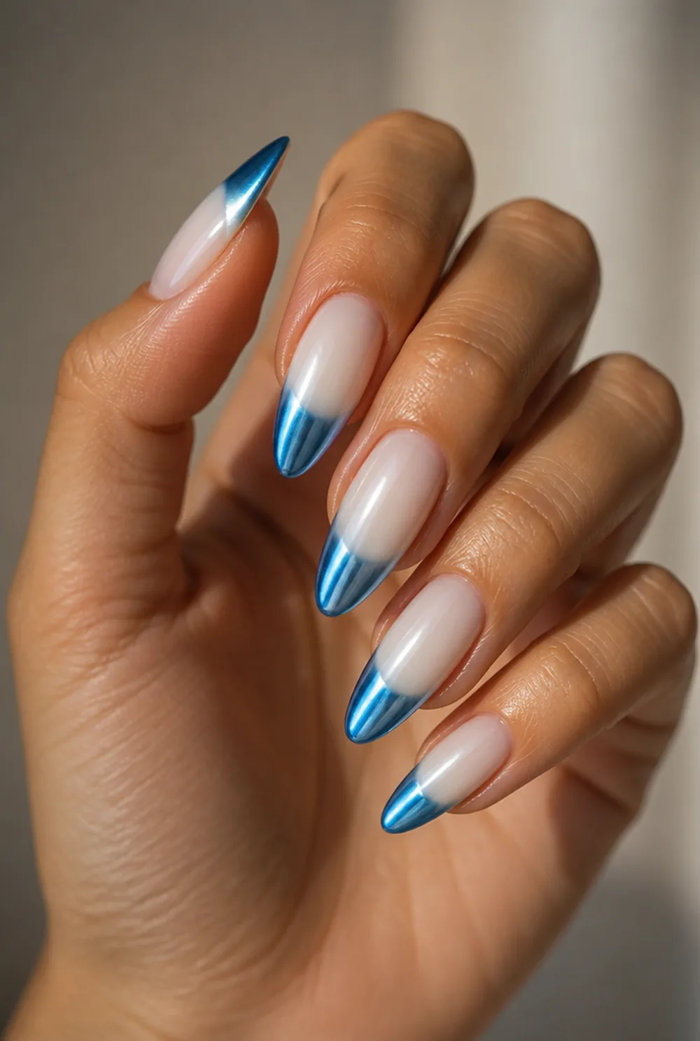 blue chrome tips nail art on olive skin, long length