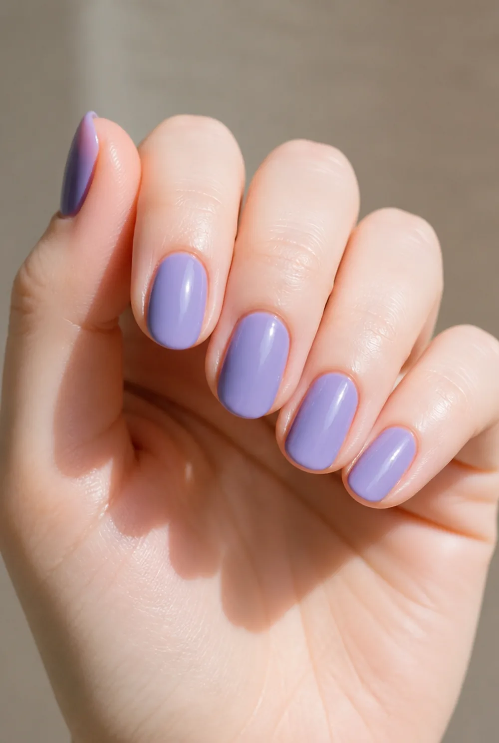 periwinkle nail art on fair skin, short length