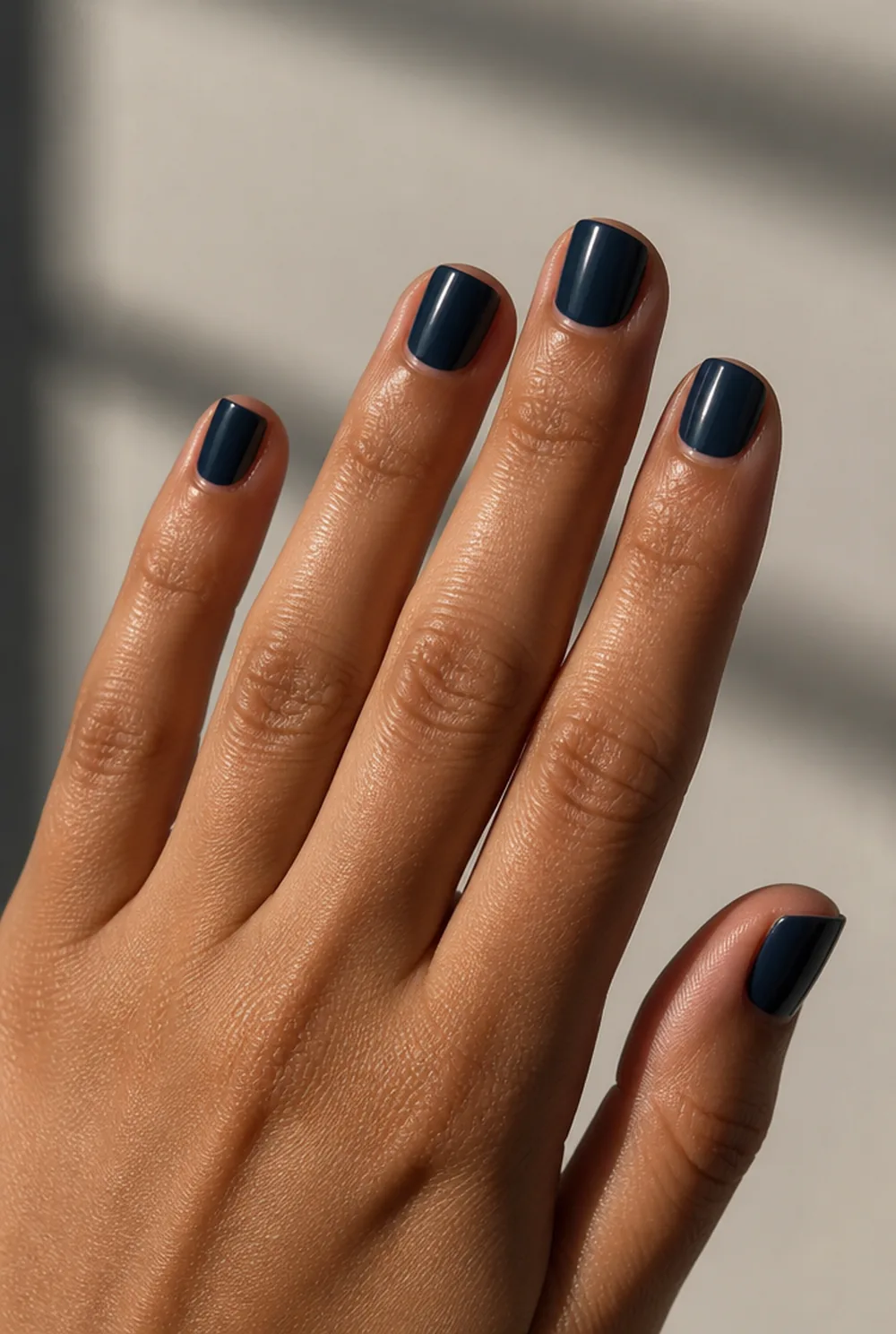 short navy squoval nail art on olive skin, long length