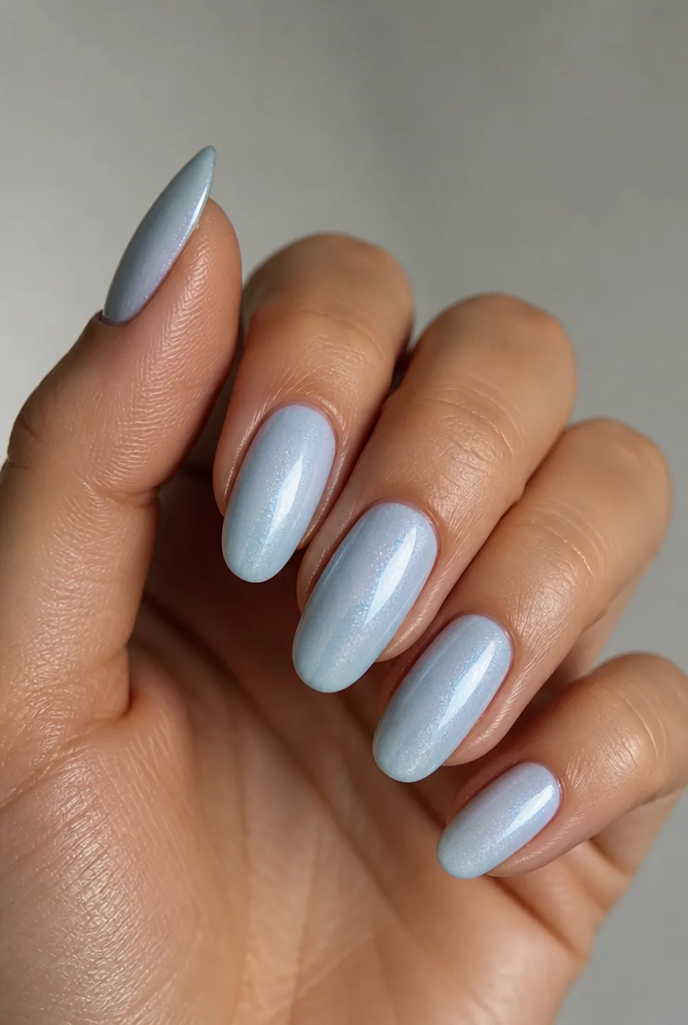 ice blue shimmer nail art on olive skin, long length