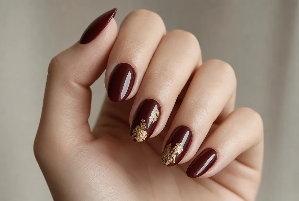 burgundy and gold foil nail art