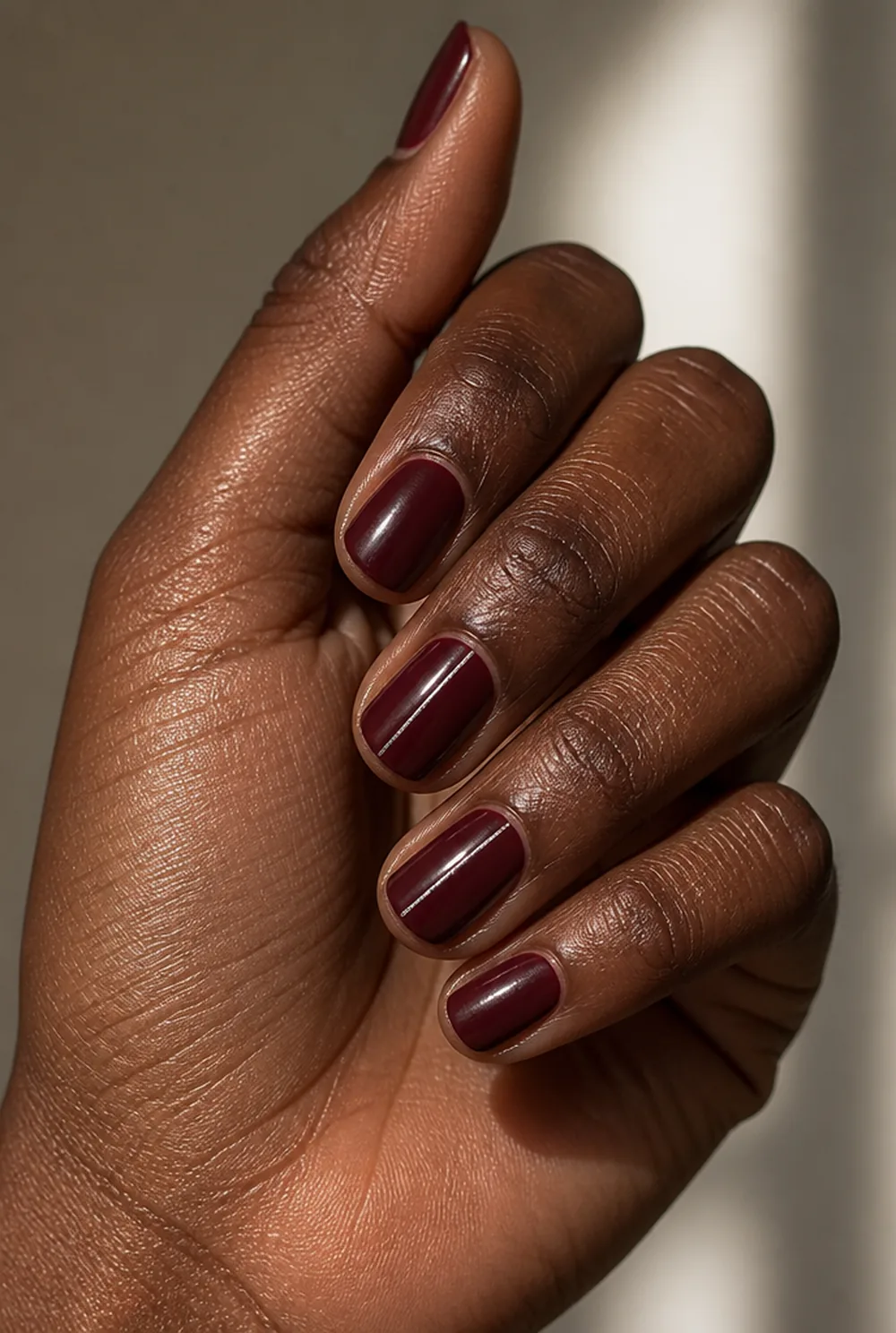 burgundy with silver line nail art on deep brown skin - PolishedAndPrettyNails.com burgundy with silver line nail art on deep brown skin