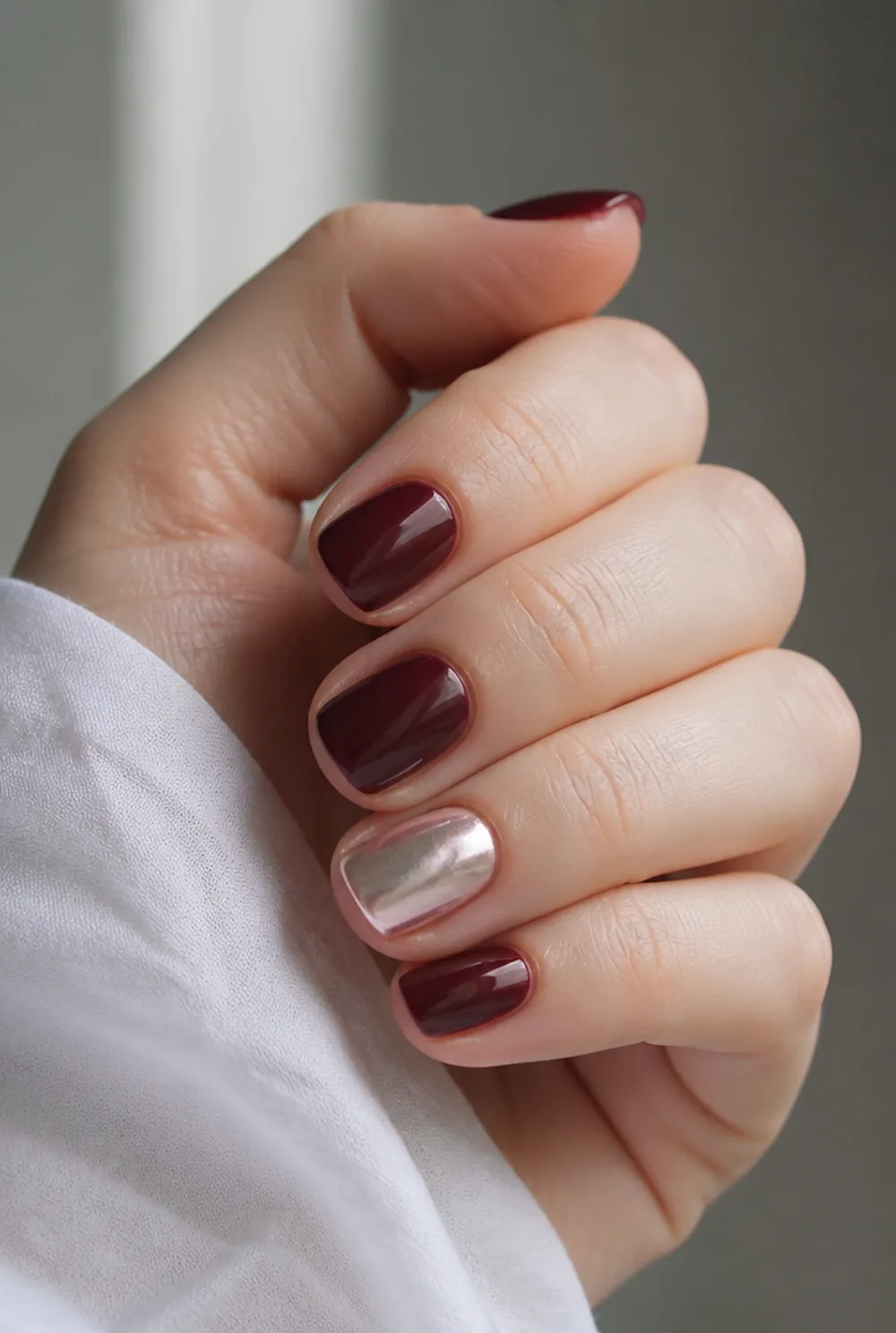 burgundy with pearl accent nail art on fair skin short length - PolishedAndPrettyNails.com burgundy with pearl accent nail art on fair skin, short length