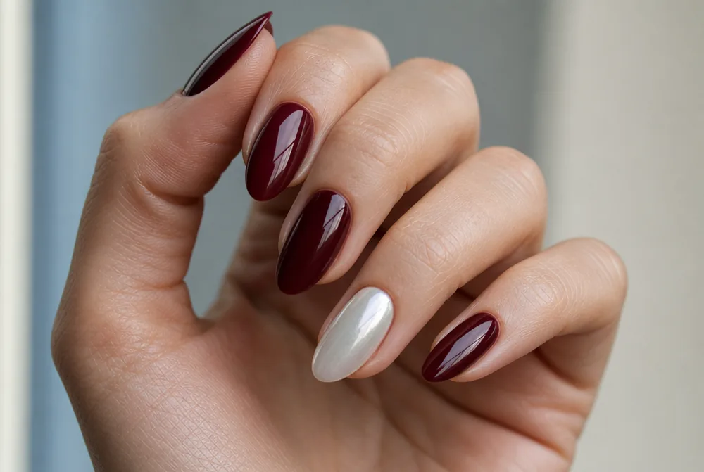 burgundy nails with pearl chrome accent finger