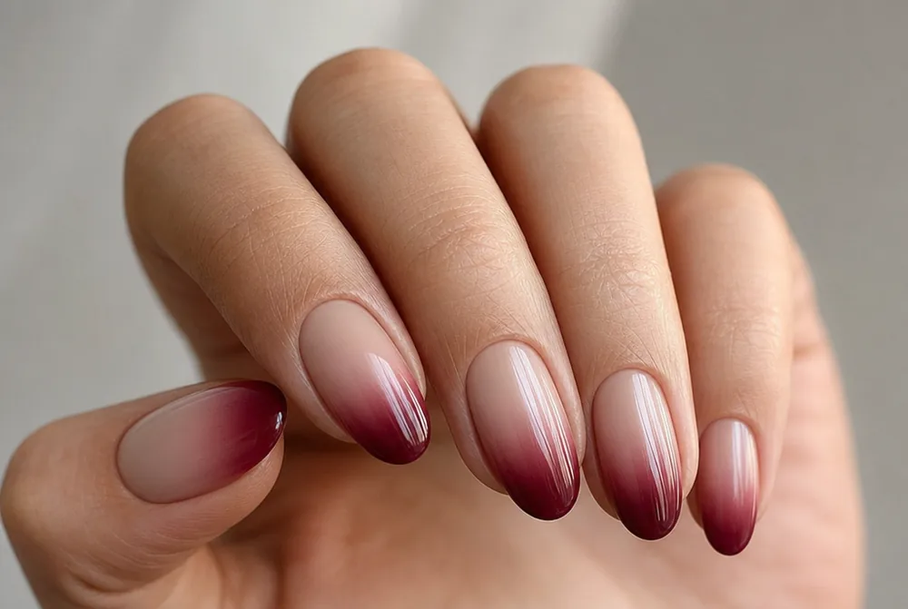burgundy ombre nails fading from nude to wine