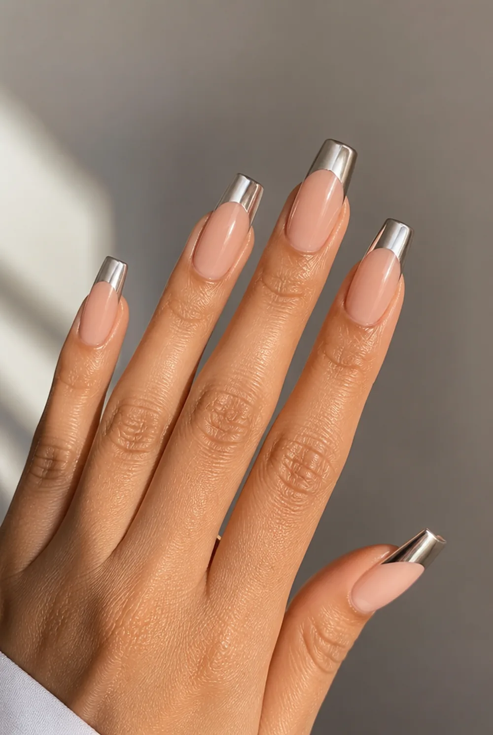 coffin with chrome tips nail art on olive skin, long length