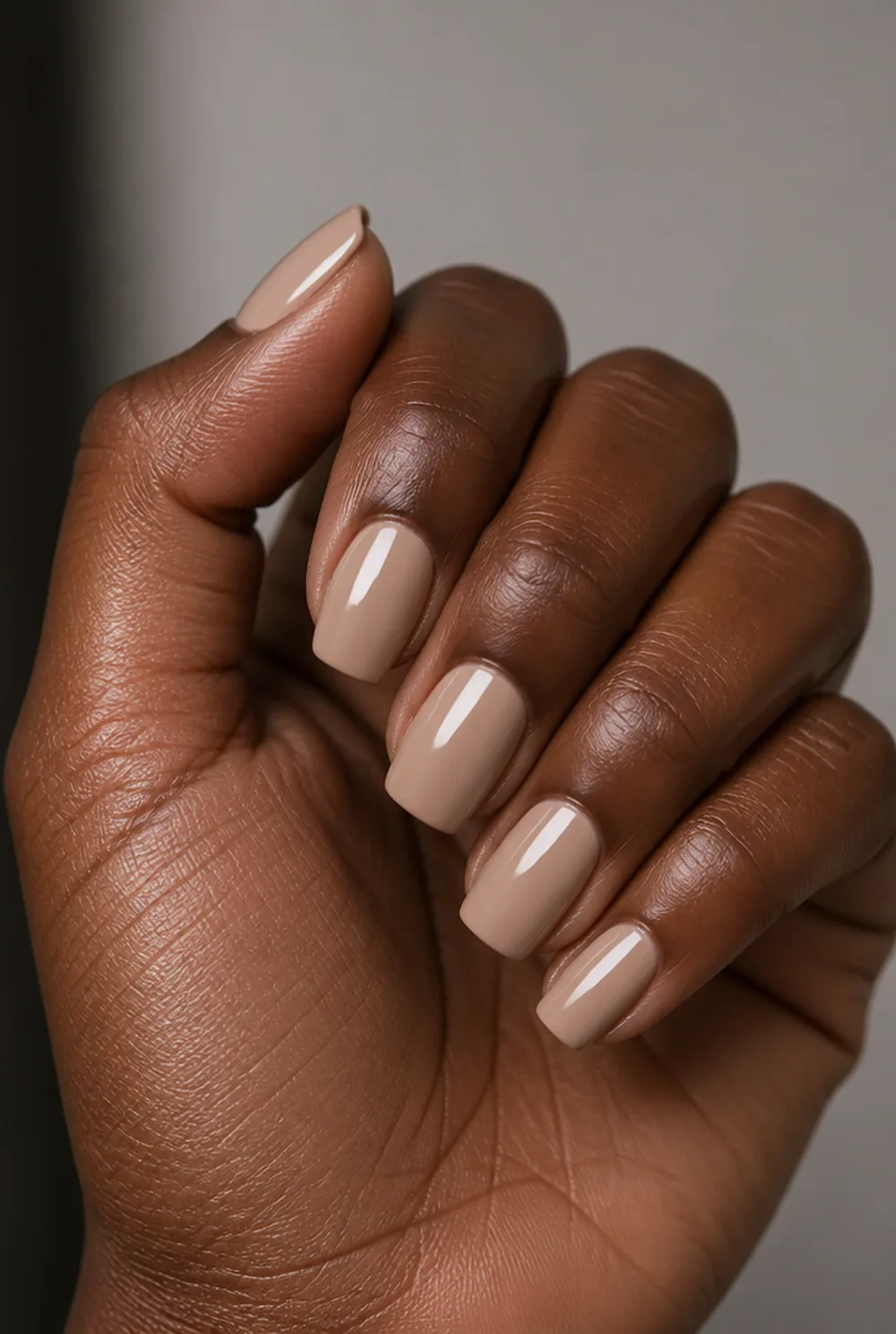 short coffin nude nail art on deep brown skin