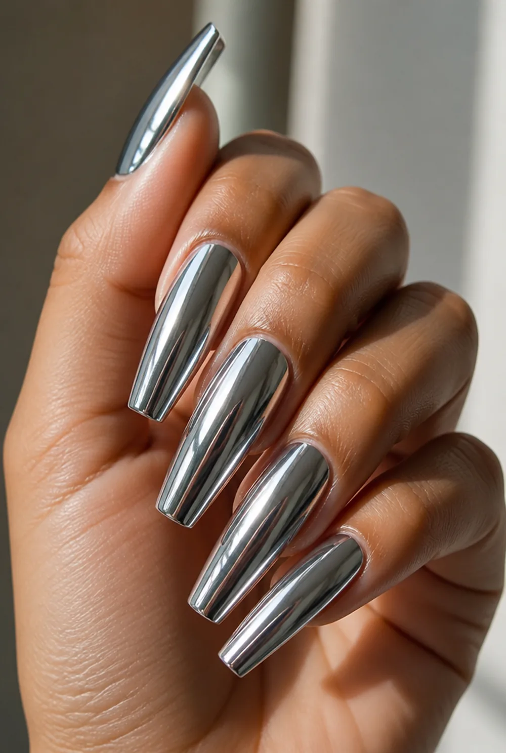 coffin chrome mirror nail art on olive skin, long length
