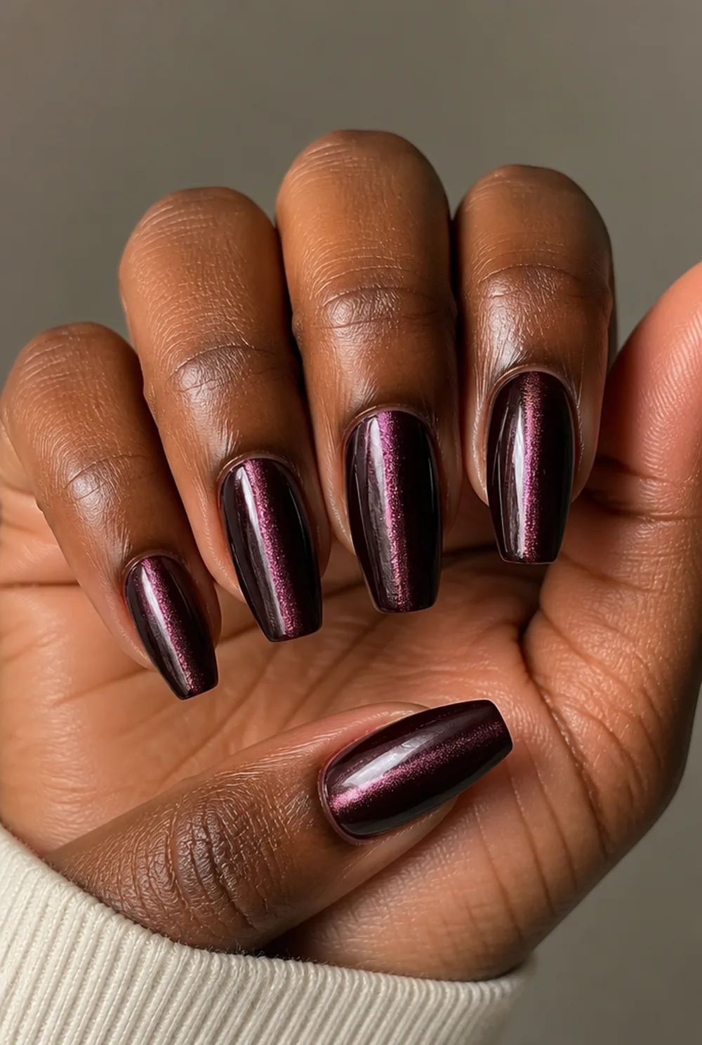 coffin cat eye nail art on deep brown skin