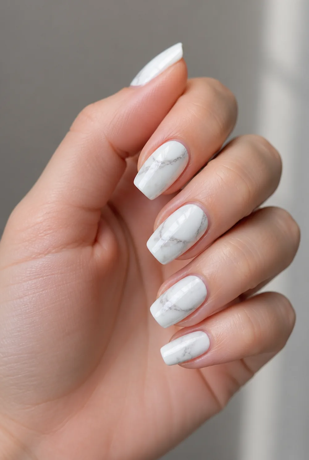 coffin marble nail art on fair skin, short length