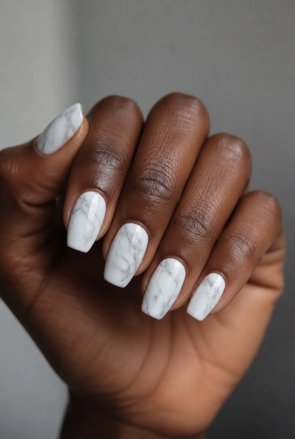 coffin marble nail art on deep brown skin