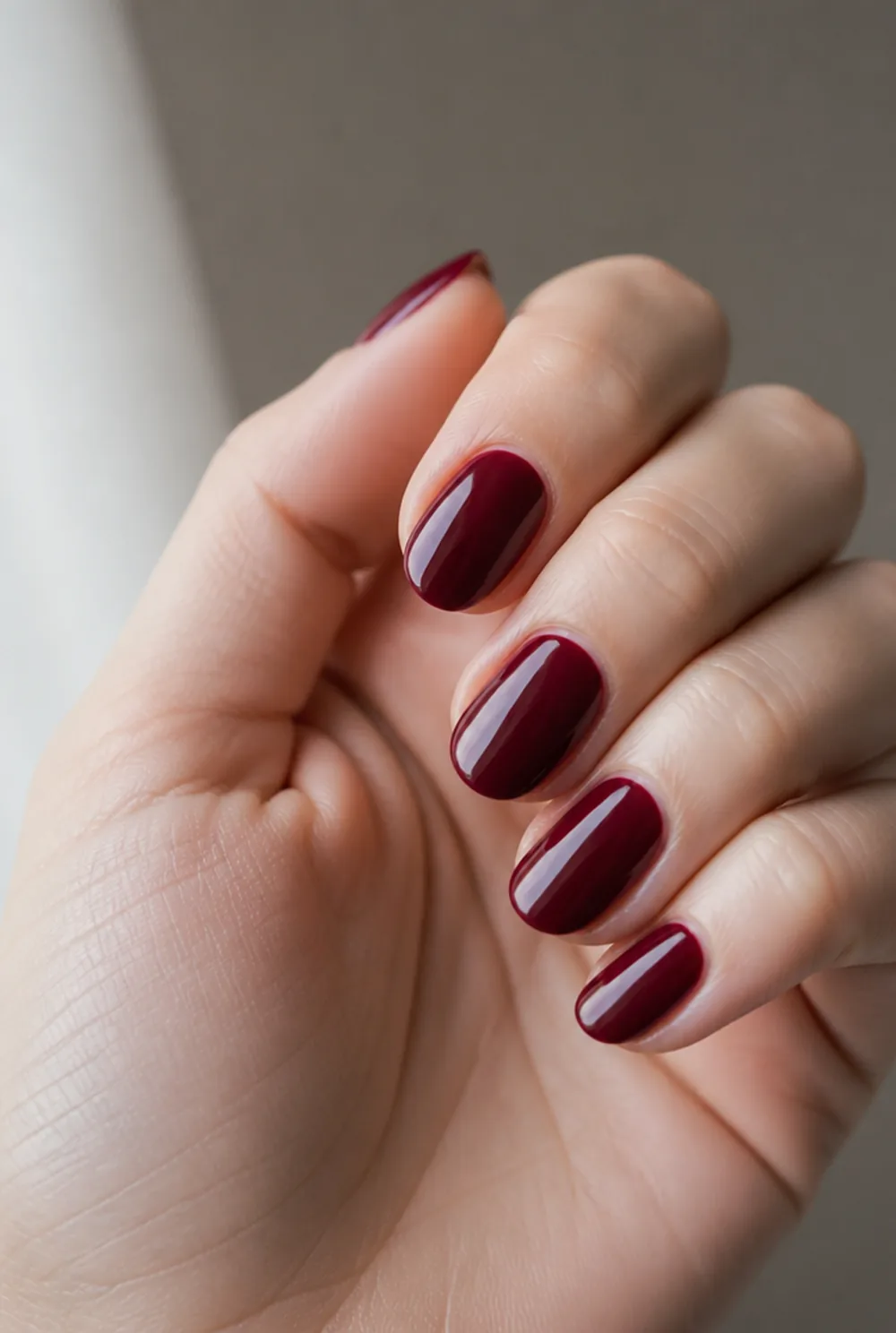 cranberry creme nail art on fair skin, short length