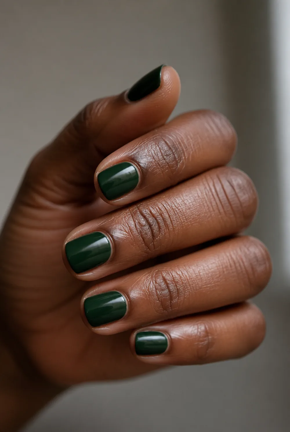 pine green gloss nail art on deep brown skin