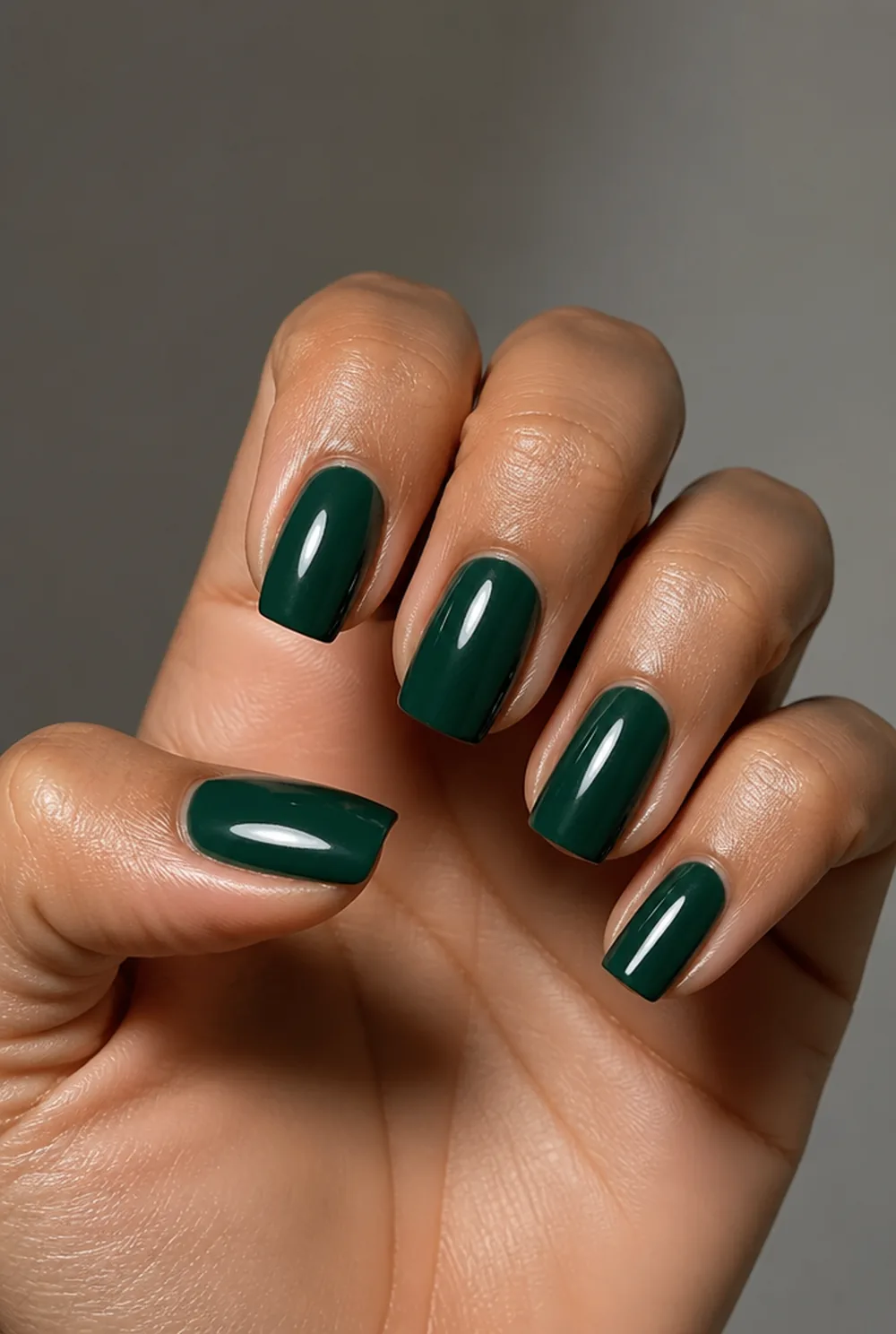 pine green gloss nail art on olive skin, long length