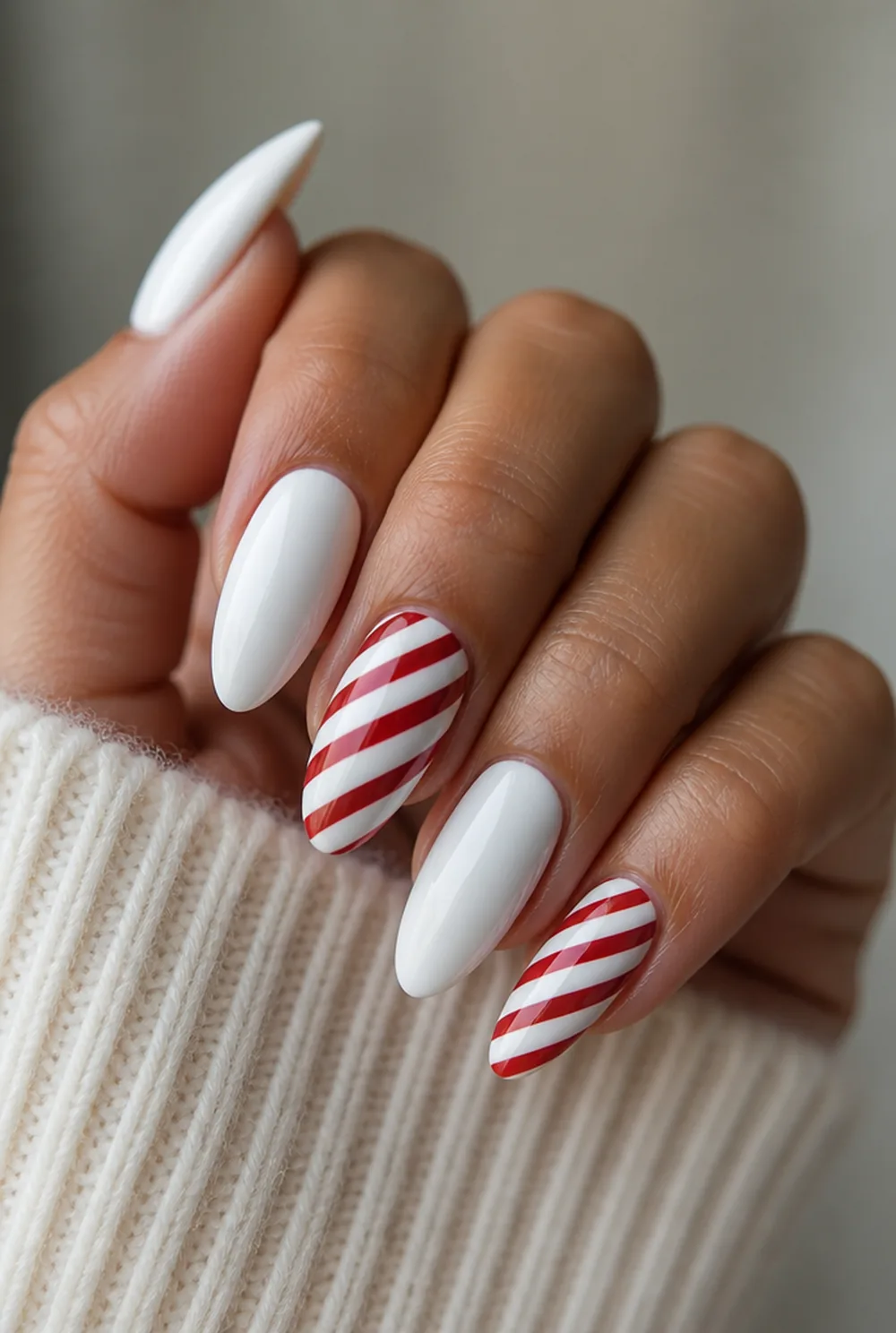 candy cane accent nail art on olive skin, long length