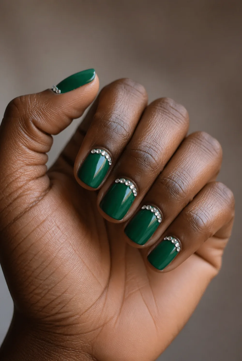 emerald with rhinestone cuff nail art on deep brown skin - PolishedAndPrettyNails.com emerald with rhinestone cuff nail art on deep brown skin