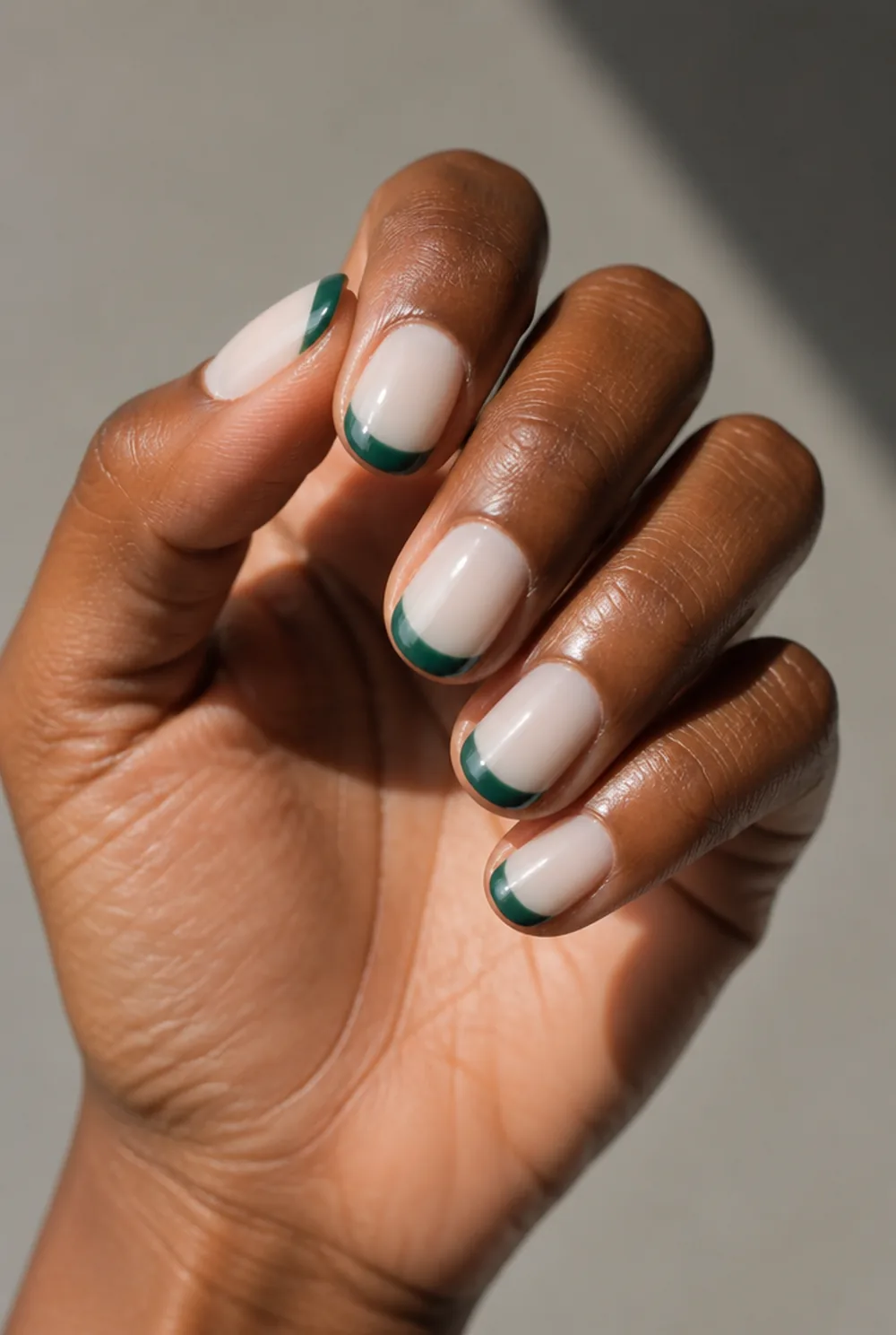 emerald on milky white nail art on deep brown skin - PolishedAndPrettyNails.com emerald on milky white nail art on deep brown skin