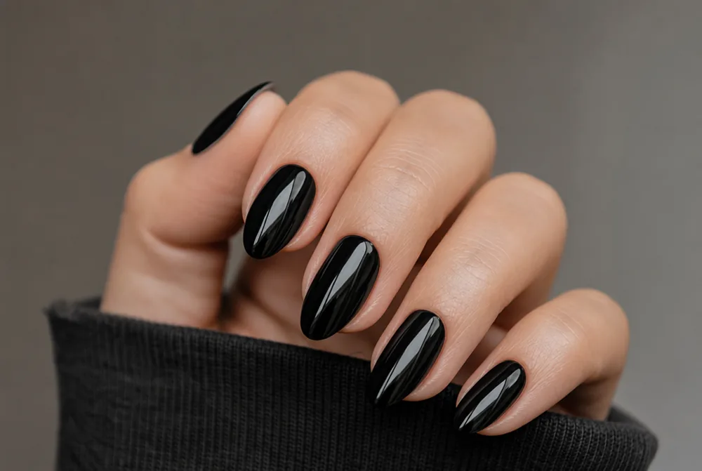 glossy black almond nails on medium length