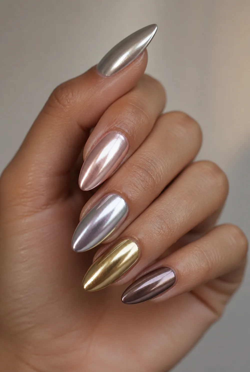 gold and pearl nail art on olive skin, long length