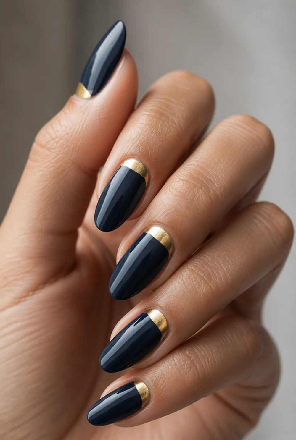gold half moon nail art on olive skin, long length