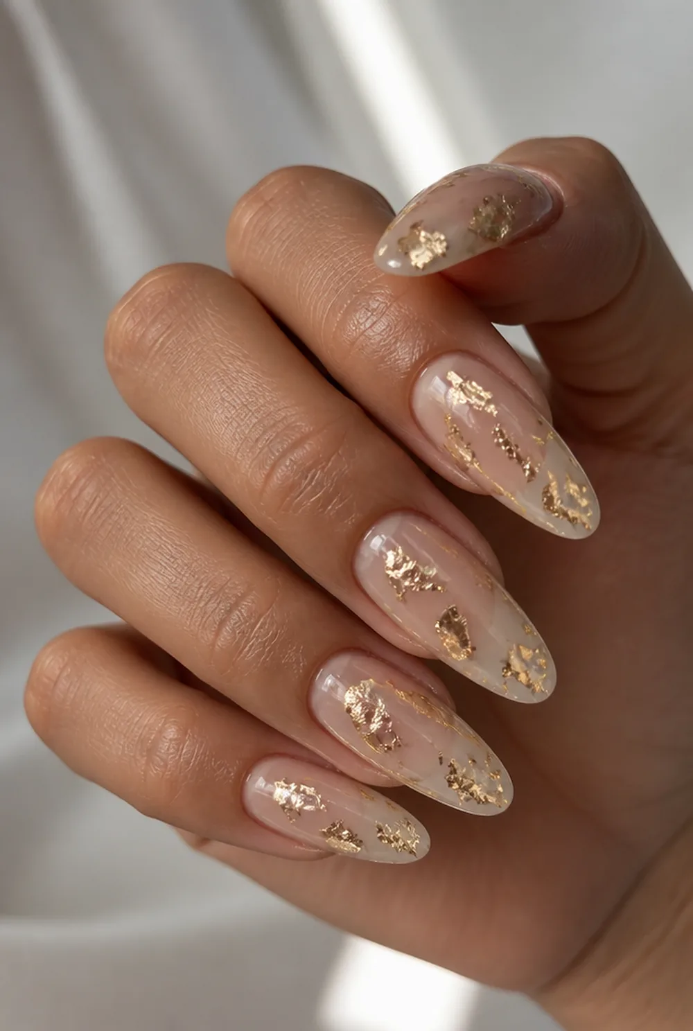 gold foil shards nail art on olive skin, long length