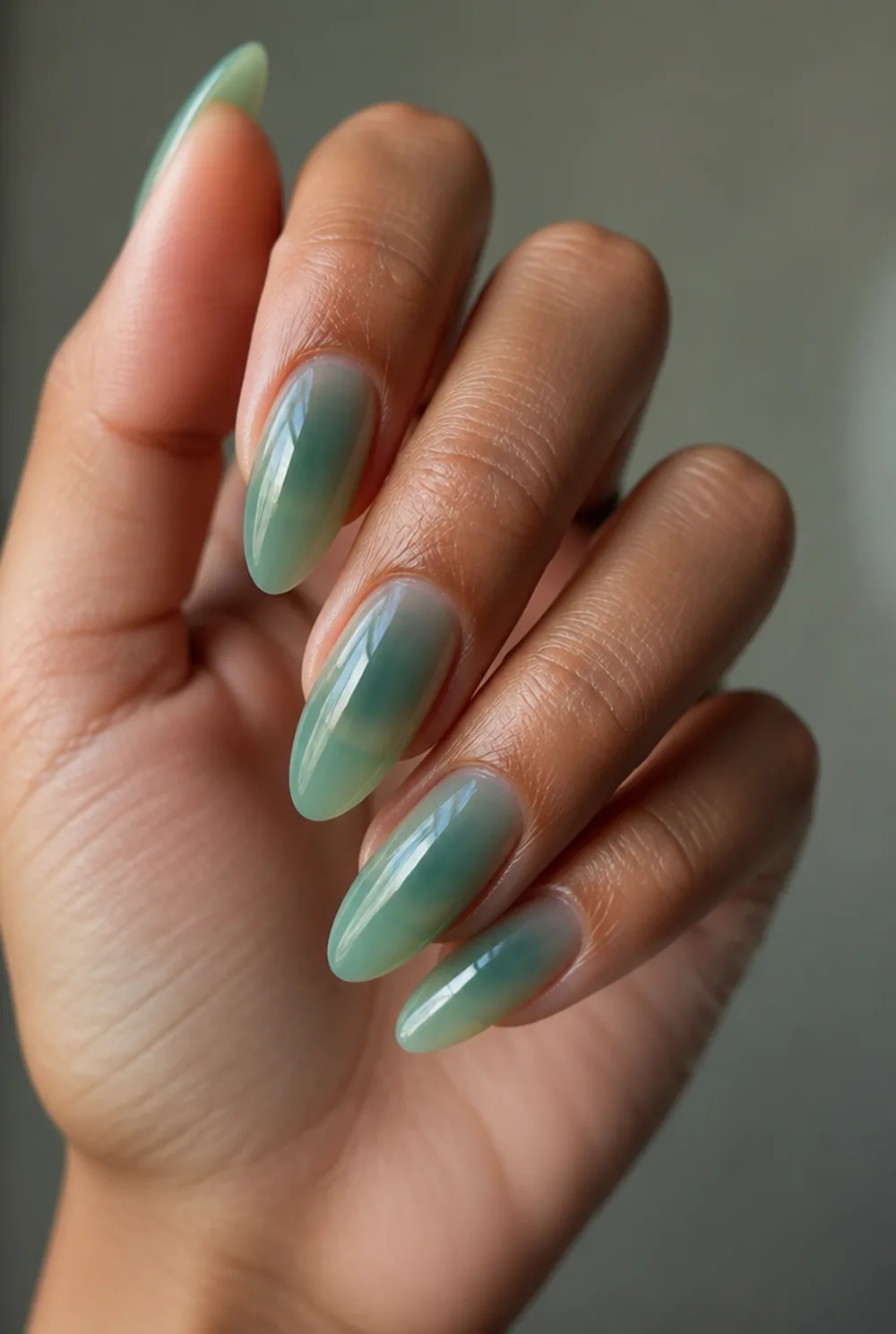 sheer green jelly nail art on olive skin, long length