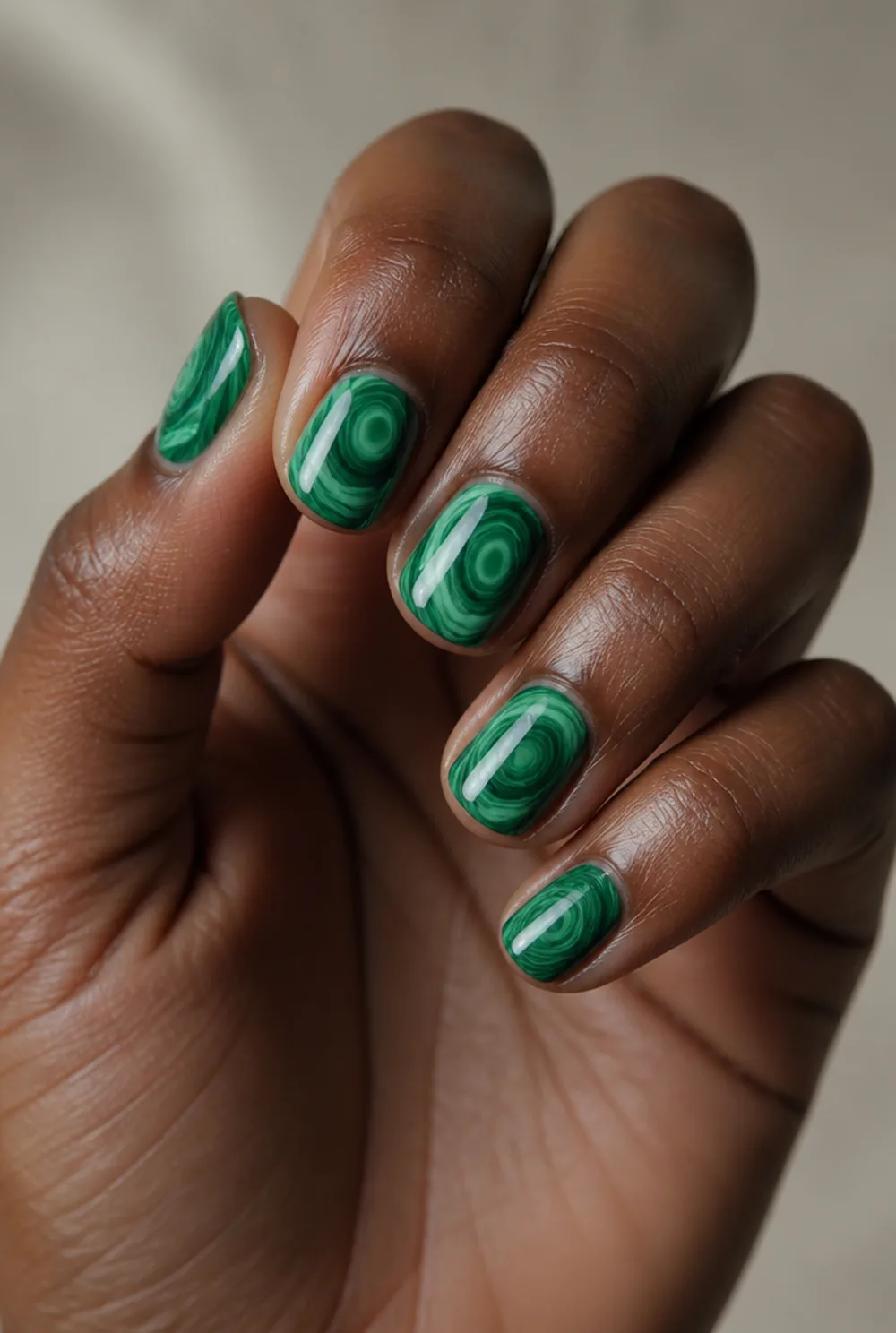 malachite marble nail art on deep brown skin