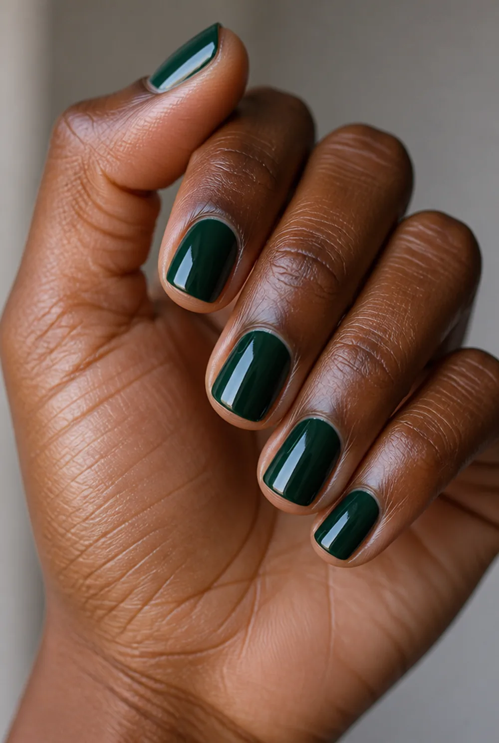 forest green nail art on deep brown skin