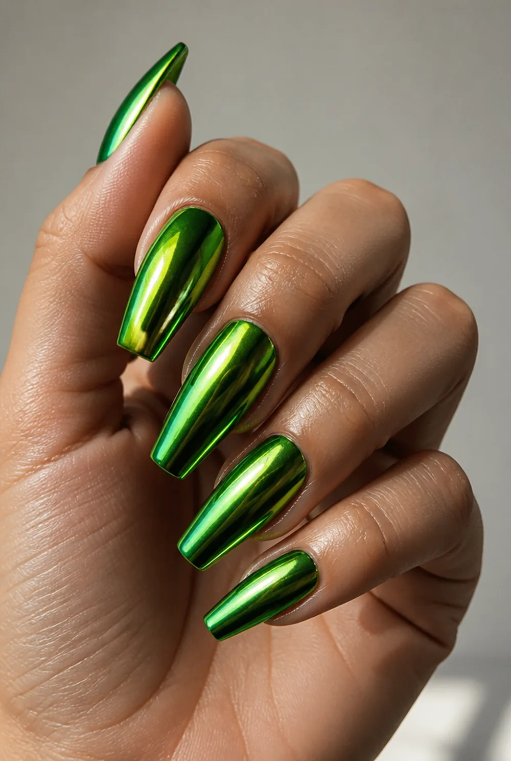 green chrome nail art on olive skin, long length