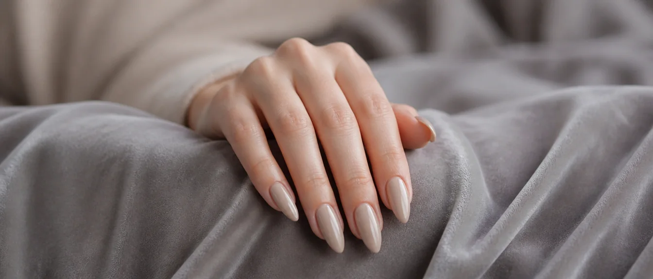 Long nude almond nails with glossy finish