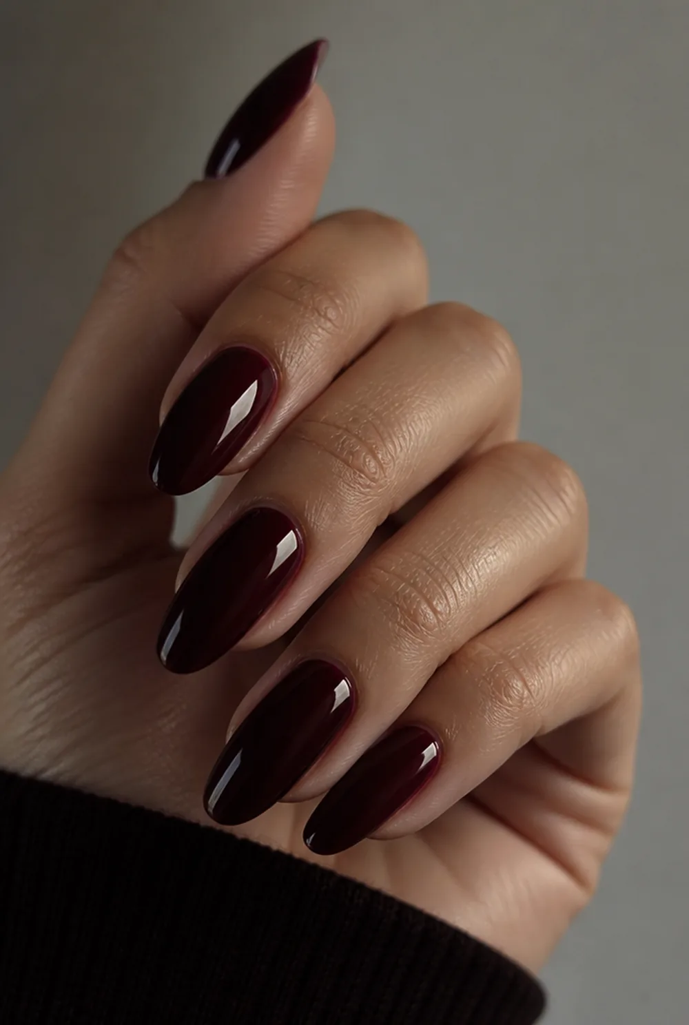 blackened cherry nail art on olive skin, long length
