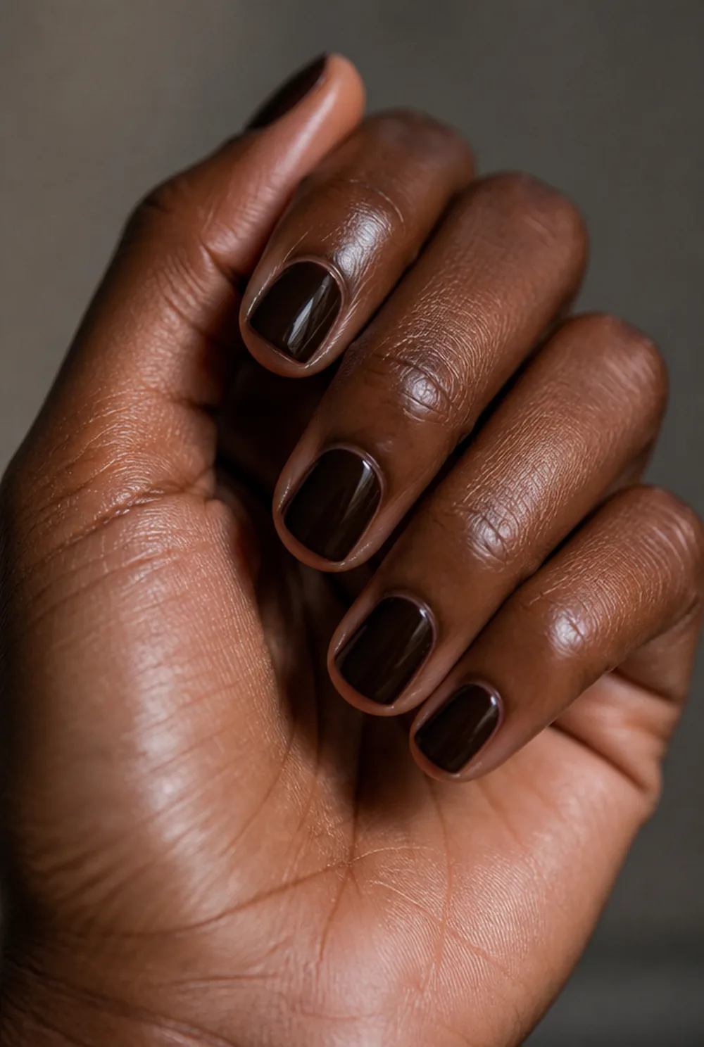 espresso nail art on deep brown skin