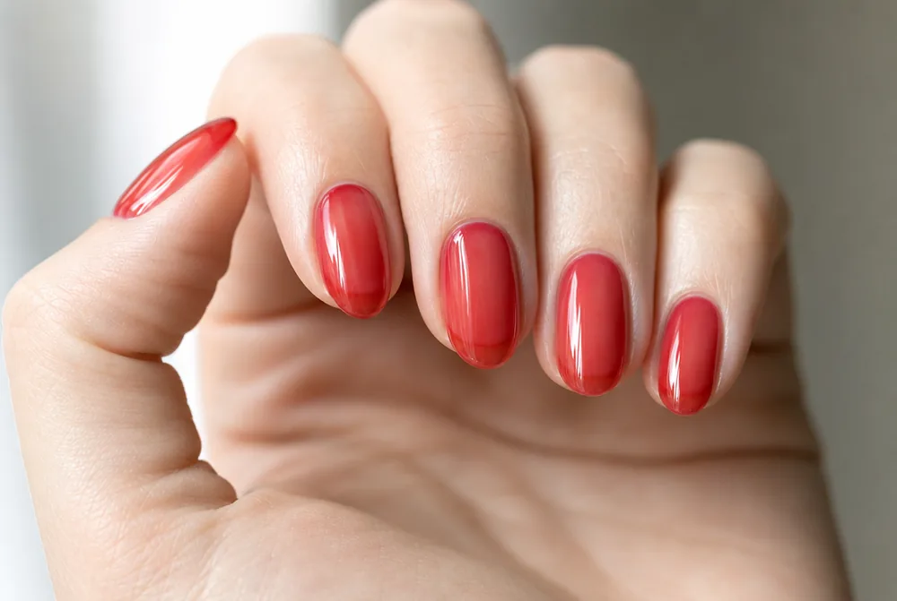 jelly red oval nails with translucent finish