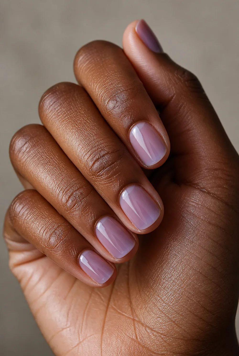 sheer lavender jelly nail art on deep brown skin