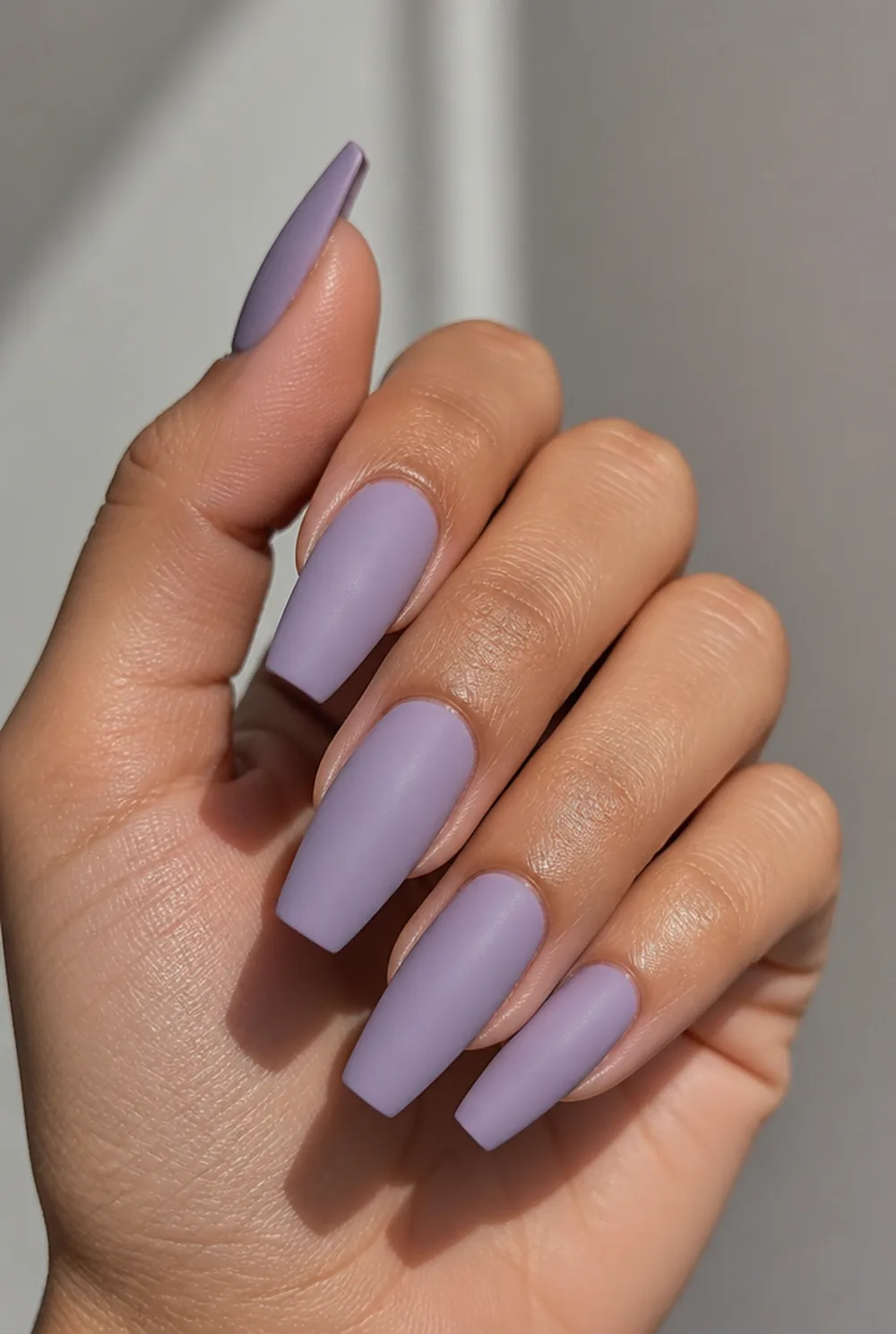 lavender matte nail art on olive skin, long length