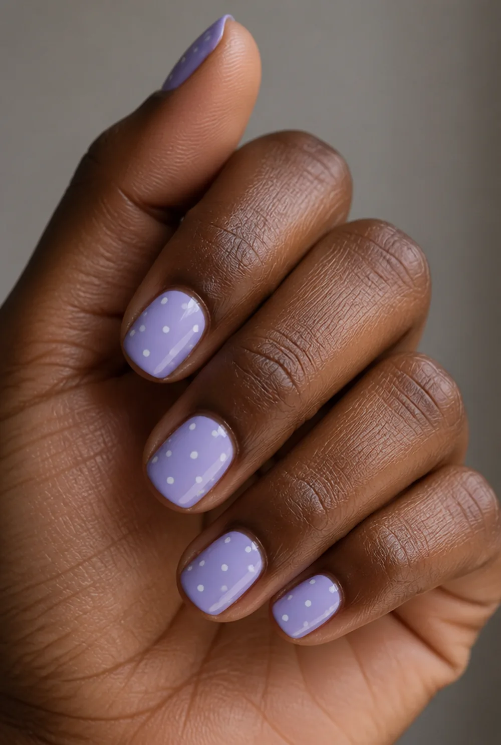 lavender with tiny dots nail art on deep brown skin
