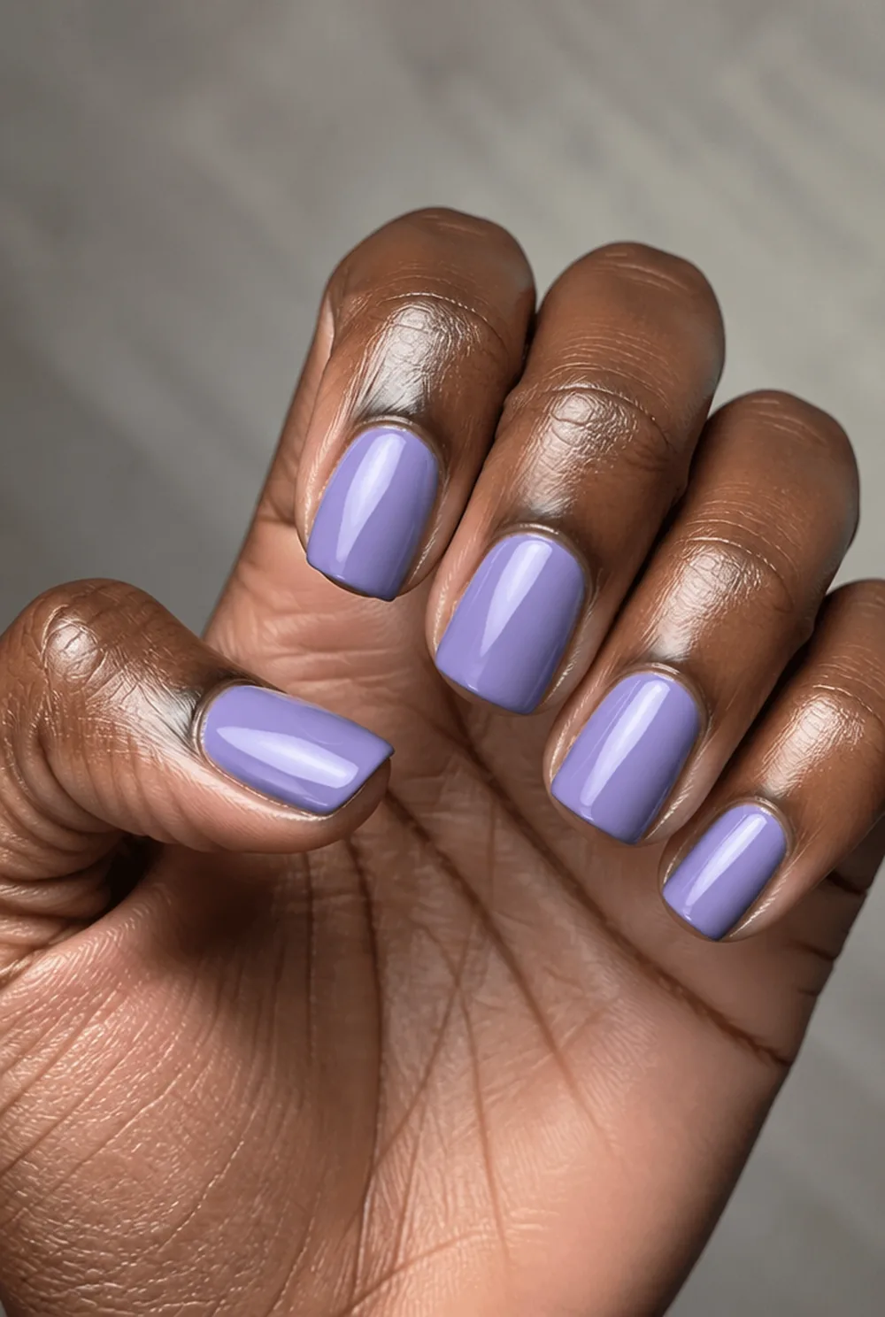 lavender creme nail art on deep brown skin