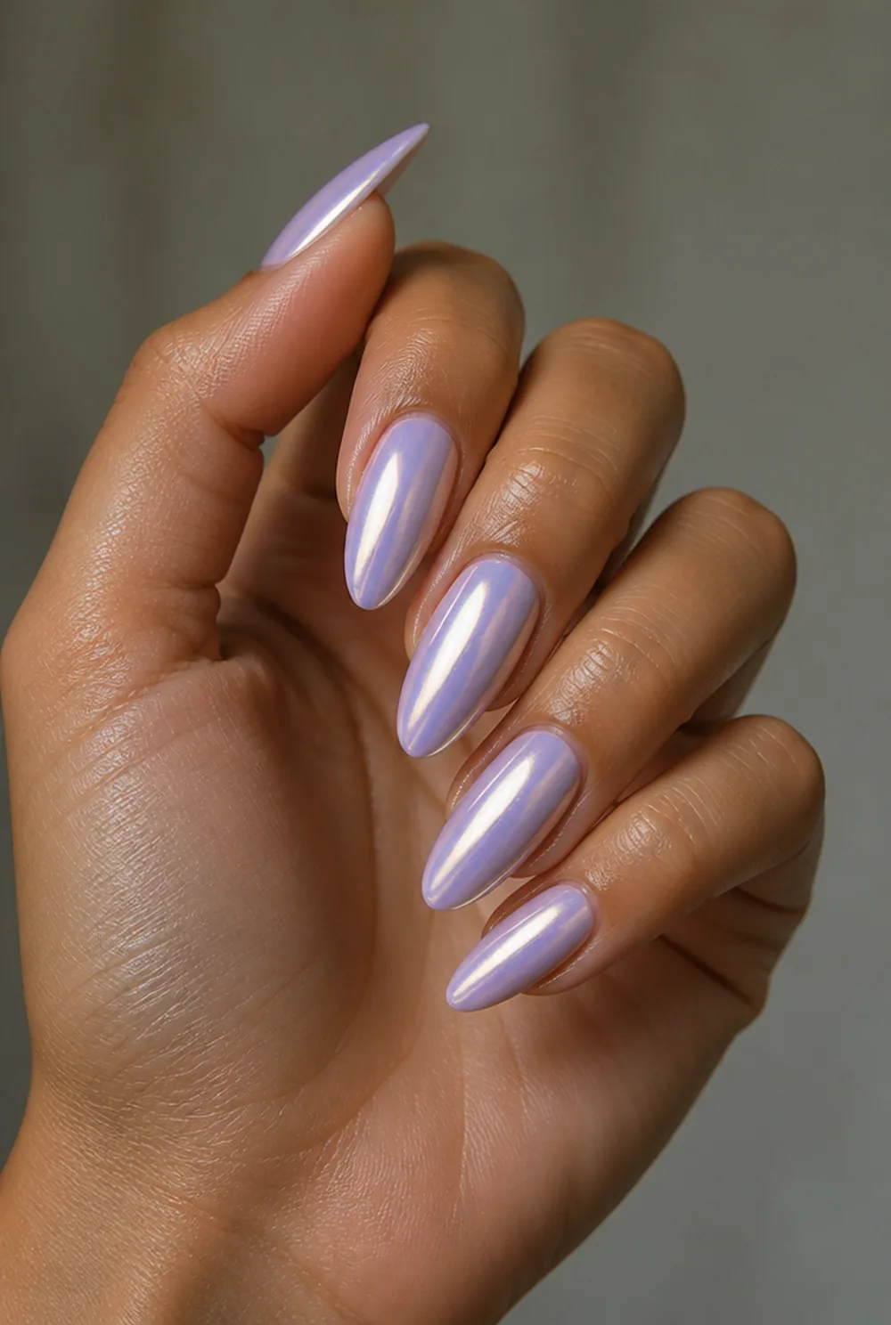 lavender chrome nail art on olive skin, long length