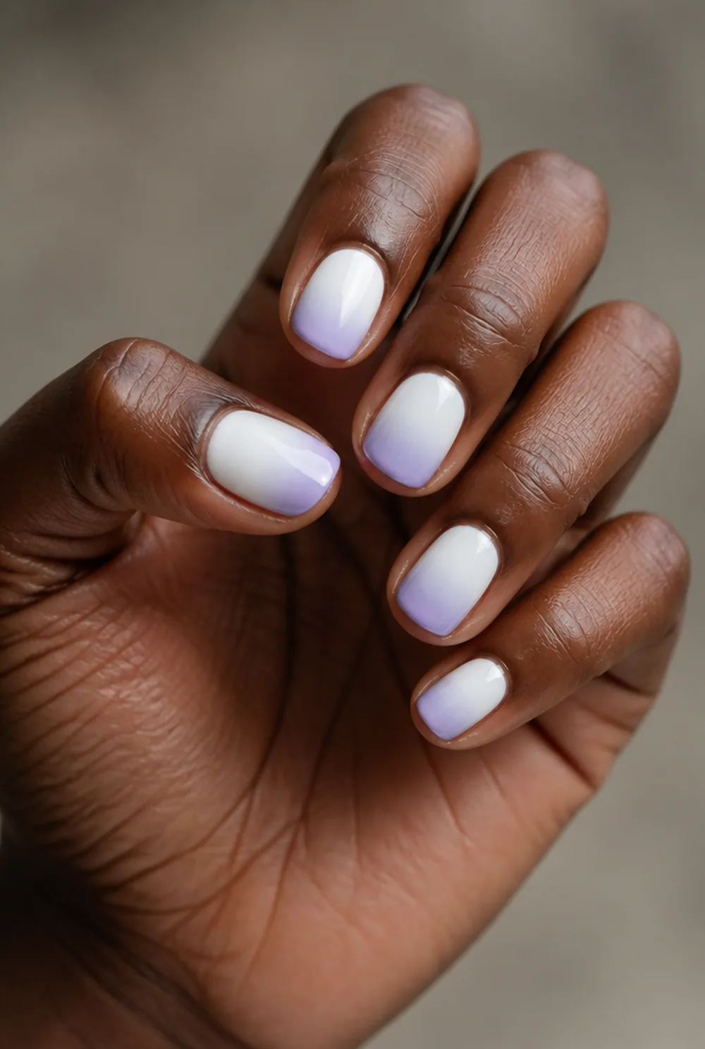 lavender ombre nail art on deep brown skin