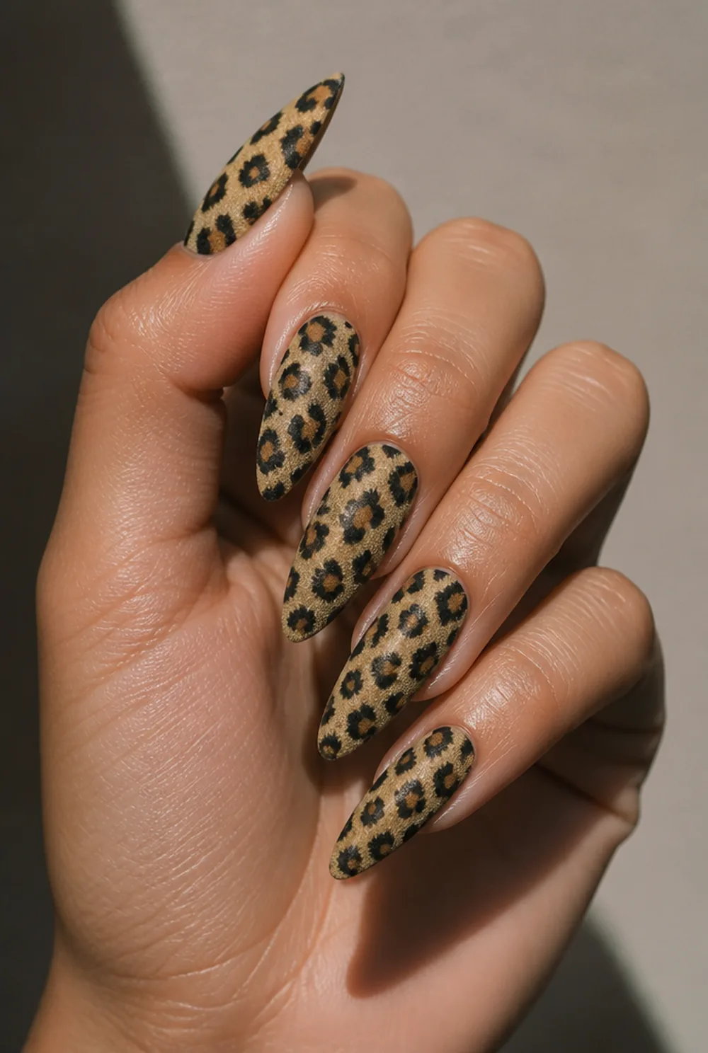 matte leopard nail art on olive skin, long length