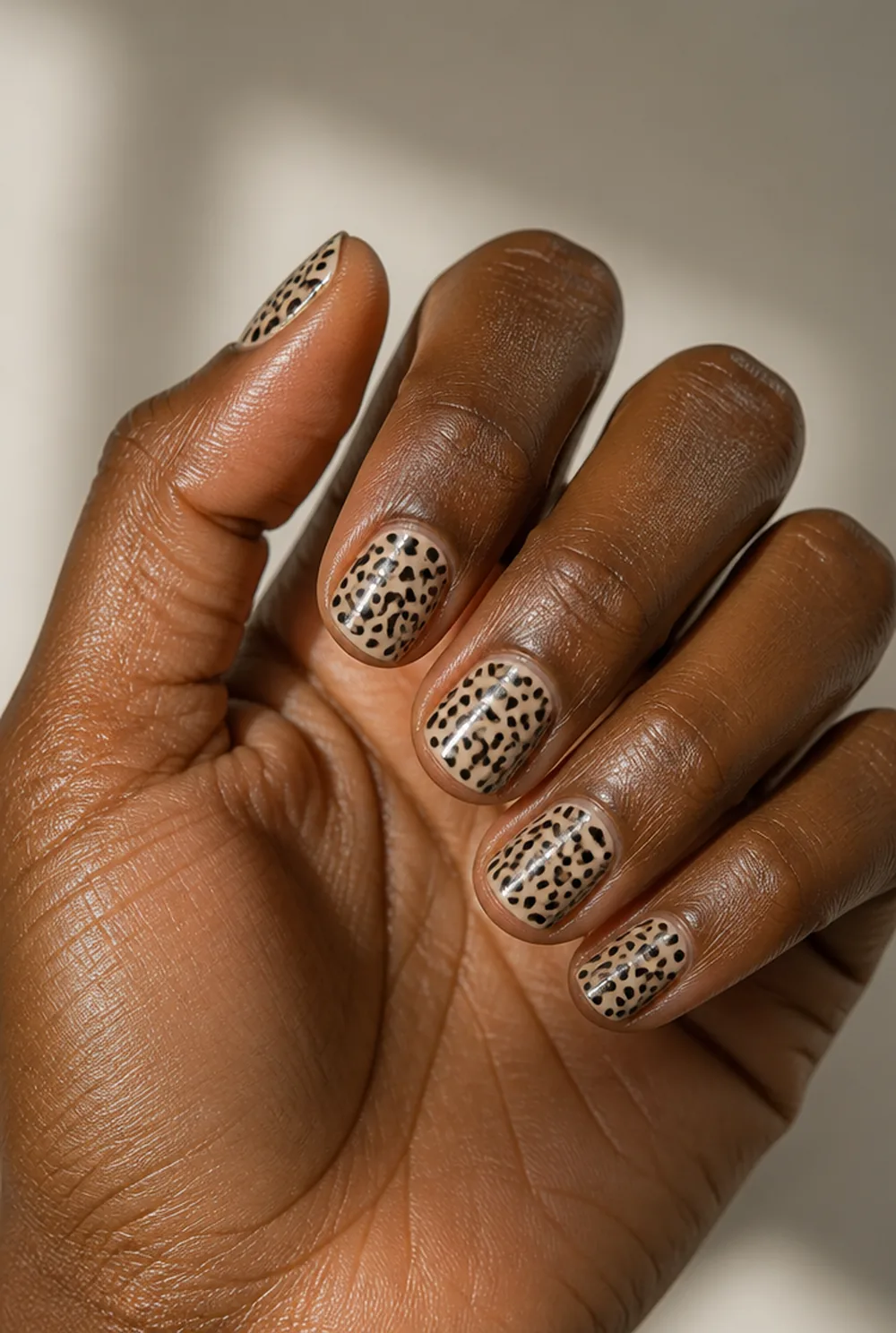 cheetah spots nail art on deep brown skin
