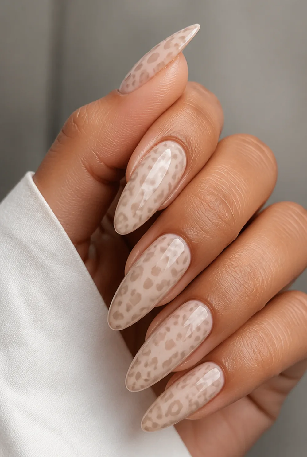 neutral leopard nail art on olive skin, long length