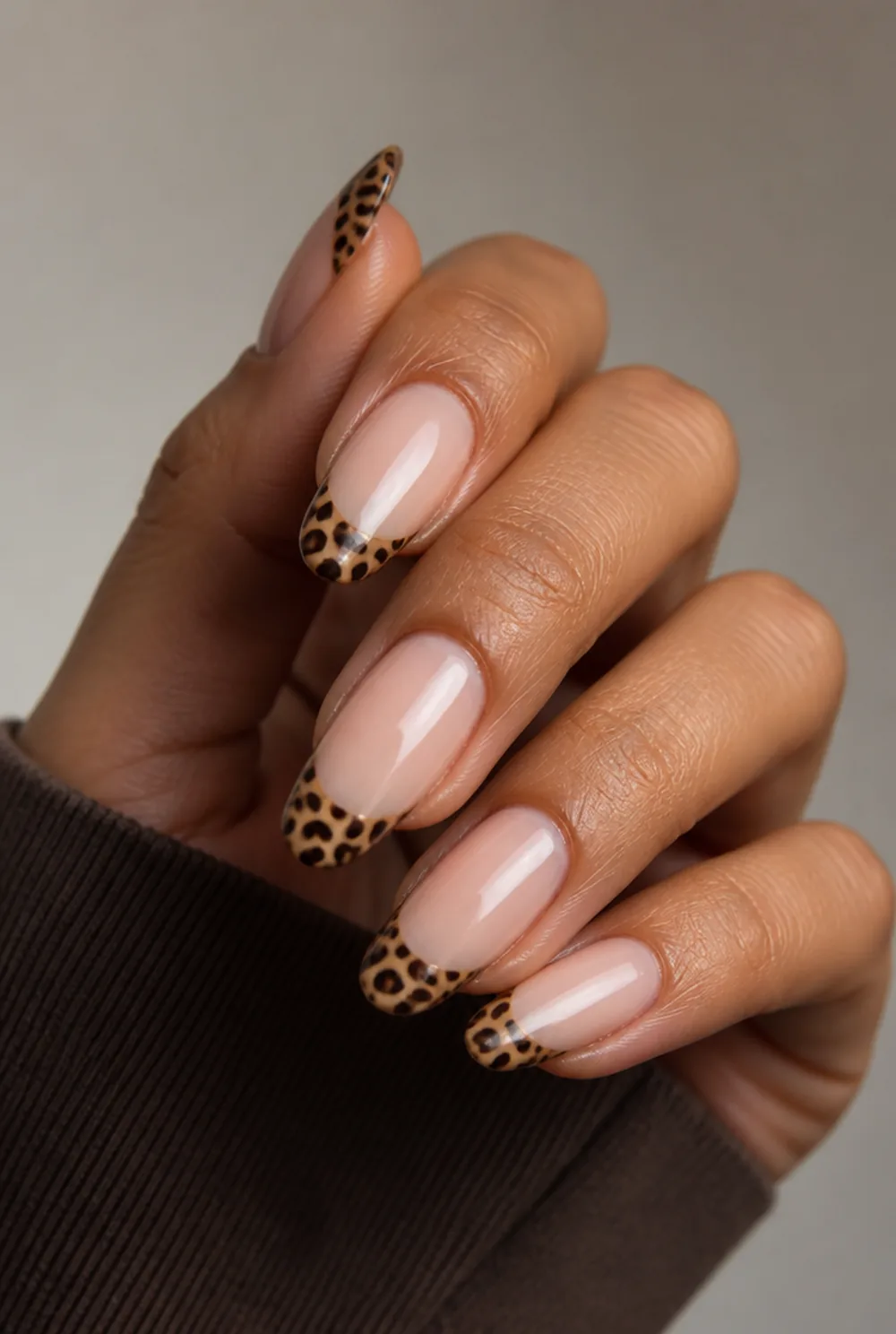leopard french tip nail art on olive skin, long length