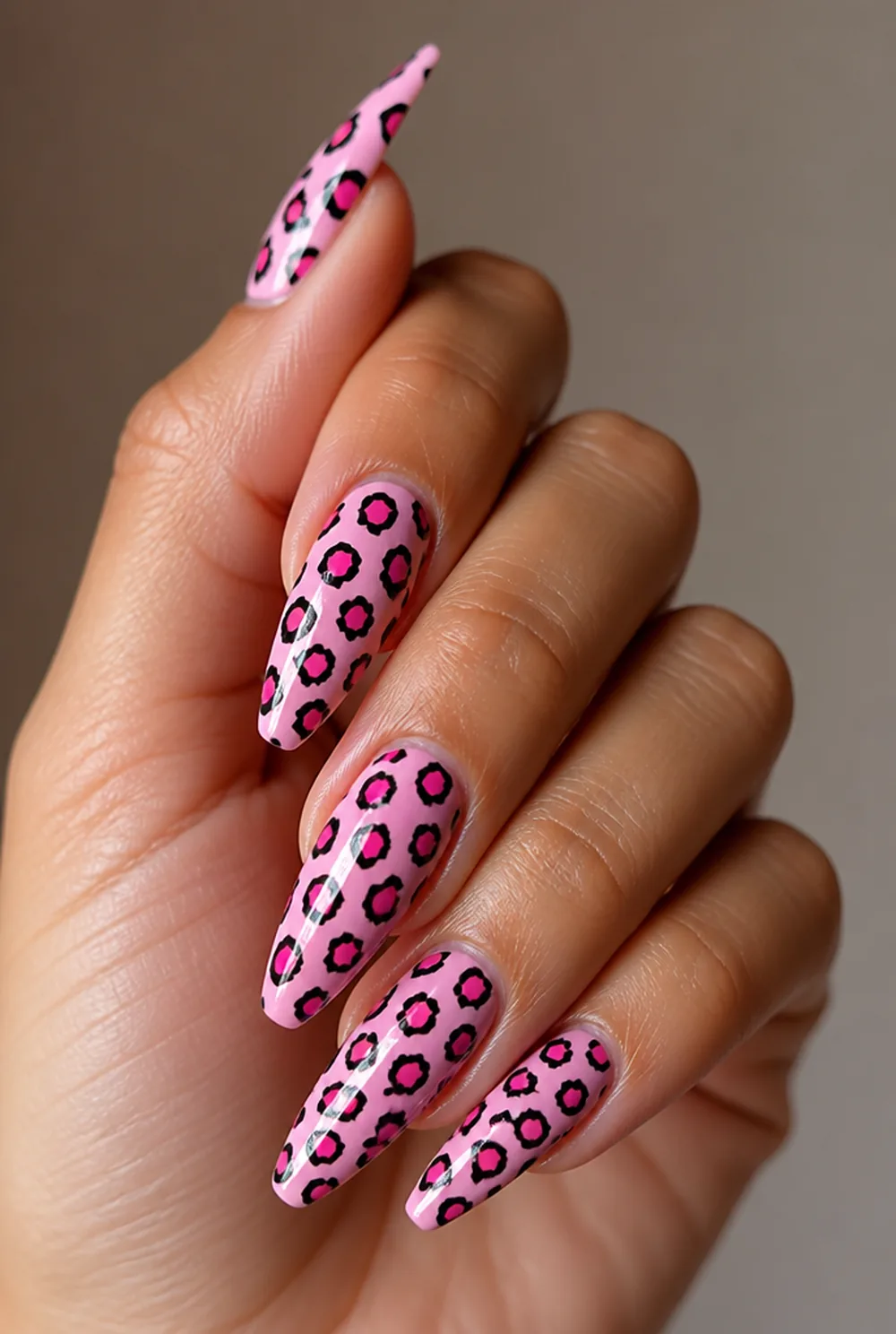 pink leopard nail art on olive skin, long length