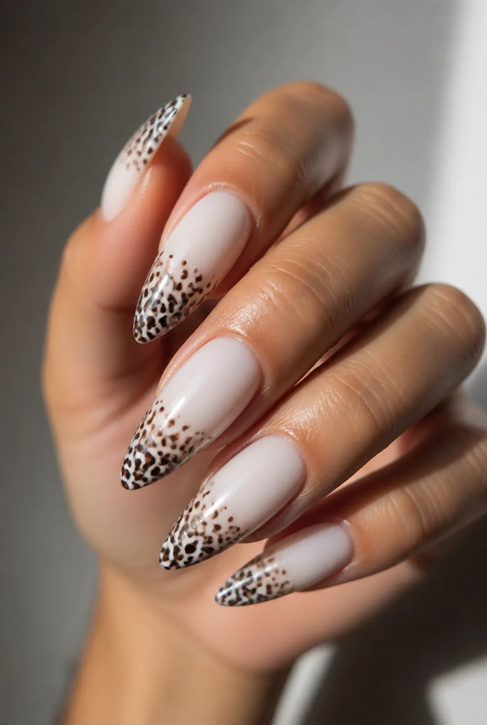 leopard tips on milky nail art on olive skin, long length