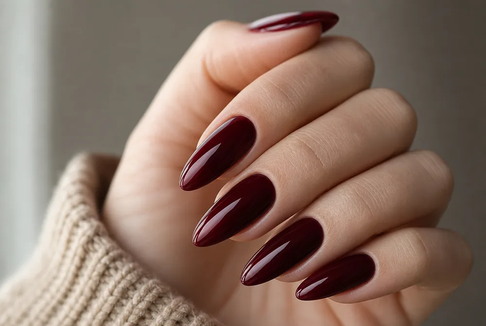 long almond burgundy nails with glossy finish