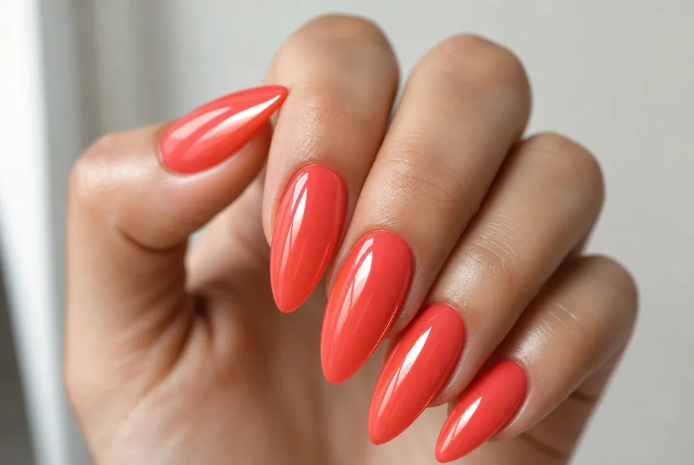 long almond coral nails with glossy finish