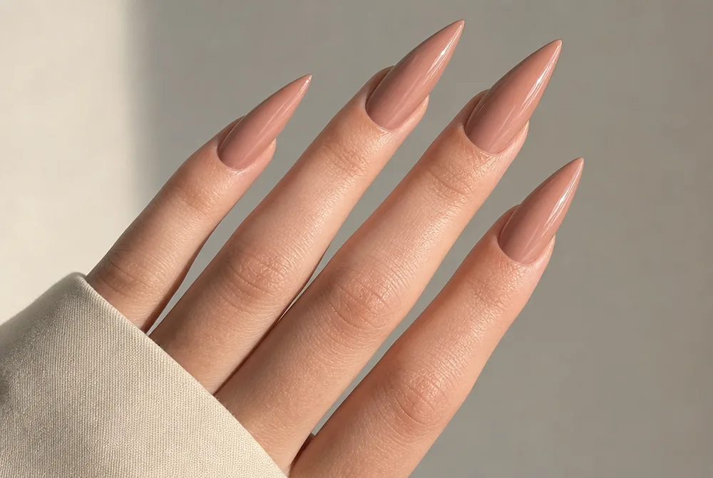 long nude stiletto nails with glossy finish