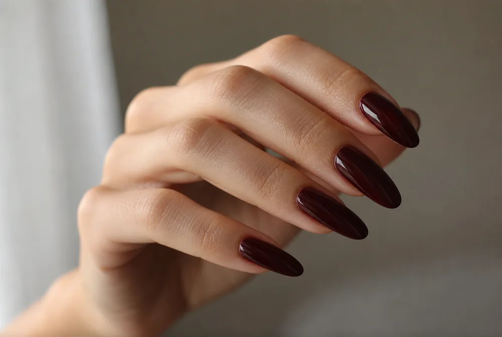 long oval nails in burgundy wine polish